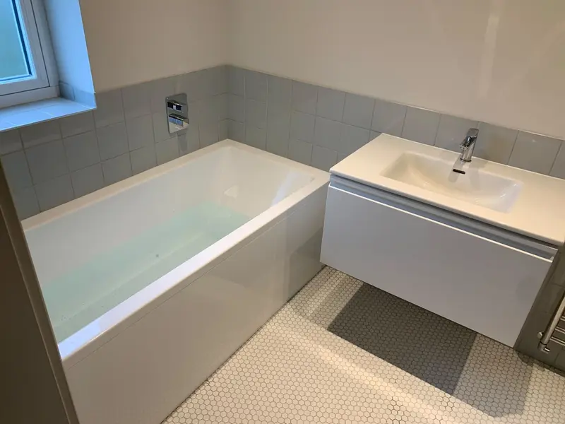 Completed bathroom installation by C Hobbs Plumbing and Heating in Bedford: tiling, sanitaryware and fitted brassware
