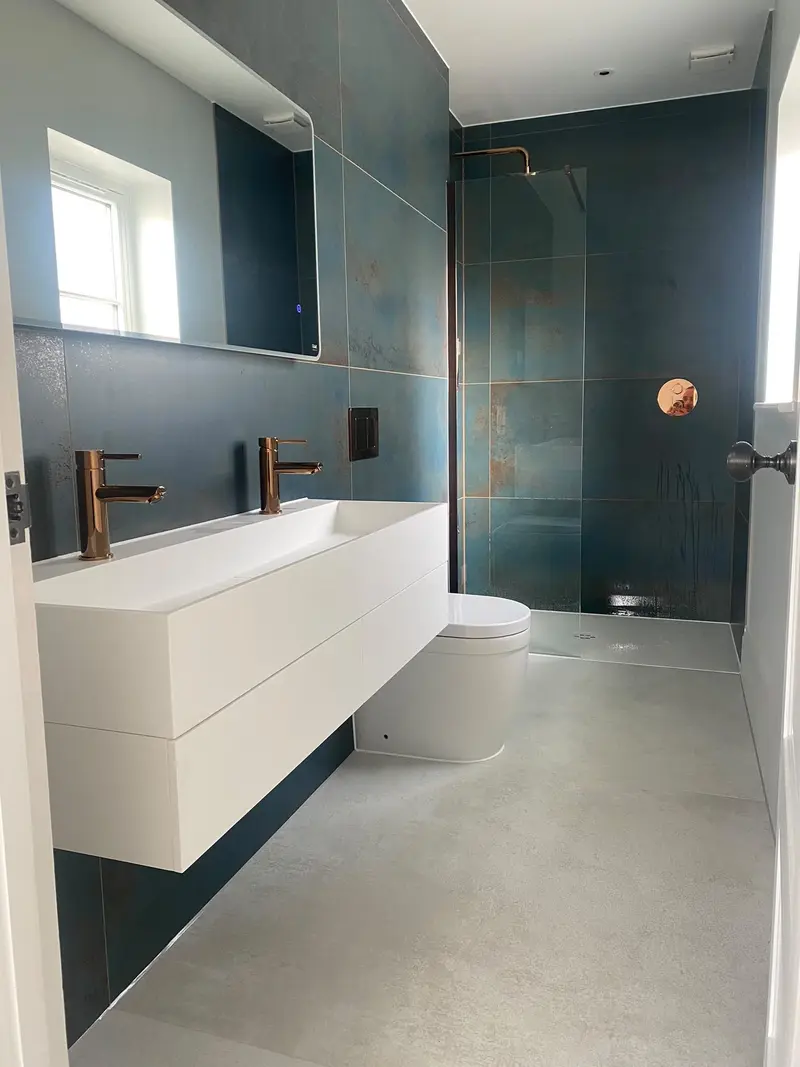 Completed bathroom installation by C Hobbs Plumbing and Heating in Dunstable: tiling, sanitaryware and fitted brassware