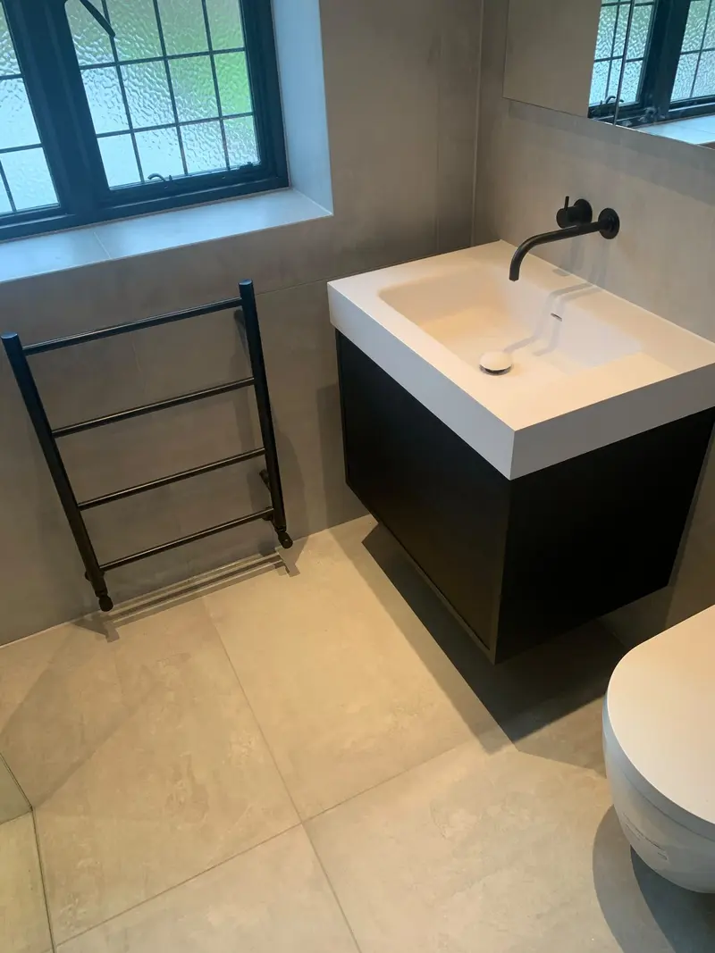 Completed bathroom installation by C Hobbs Plumbing and Heating in Dunstable: tiling, sanitaryware and fitted brassware
