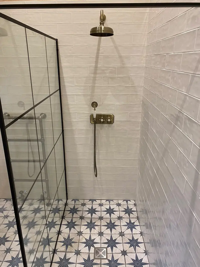 Completed bathroom installation by C Hobbs Plumbing and Heating in Luton: tiling, sanitaryware and fitted brassware