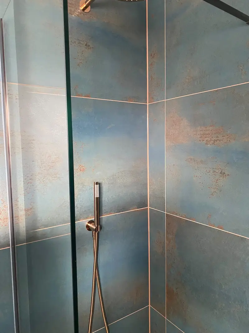 Completed bathroom installation by C Hobbs Plumbing and Heating in Milton Keynes: tiling, sanitaryware and fitted brassware
