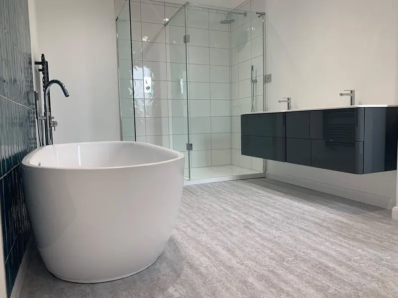 Completed bathroom installation by C Hobbs Plumbing and Heating in Harpenden: tiling, sanitaryware and fitted brassware