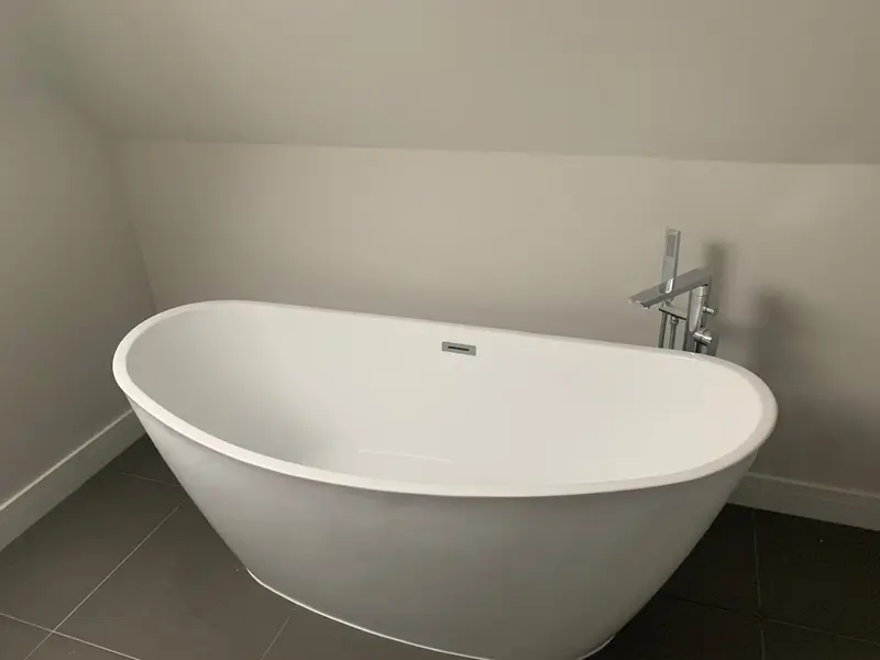 Completed bathroom installation by C Hobbs Plumbing and Heating in Milton Keynes: tiling, sanitaryware and fitted brassware