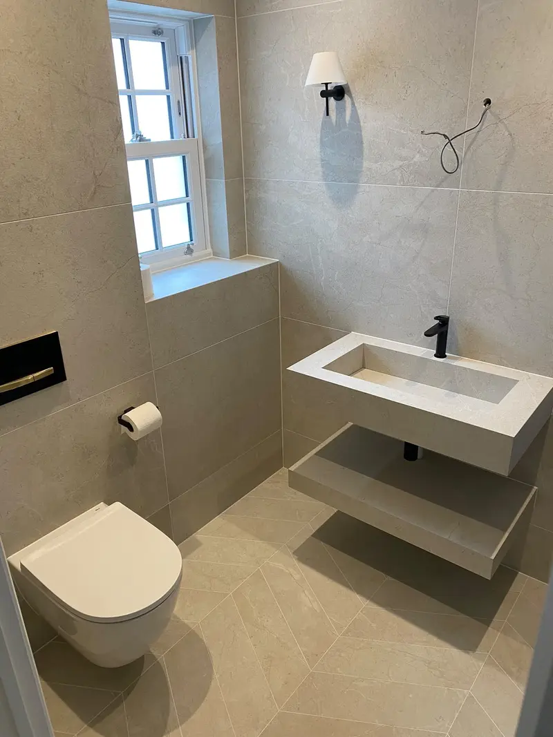 Completed bathroom installation by C Hobbs Plumbing and Heating in Bedfordshire: tiling, sanitaryware and fitted brassware