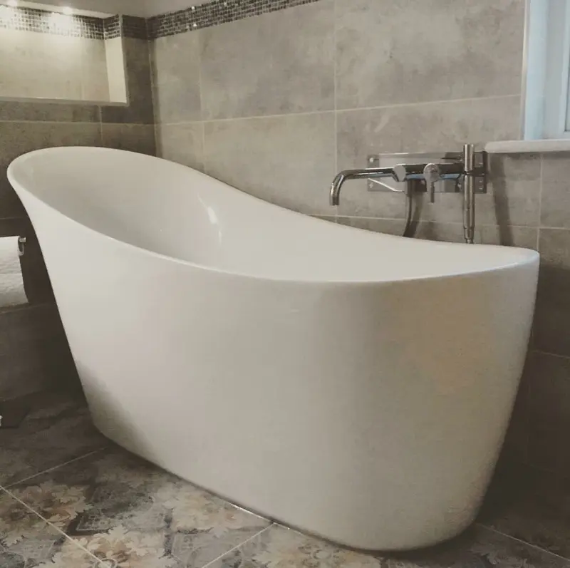 Completed bathroom installation by C Hobbs Plumbing and Heating in Hertfordshire: tiling, sanitaryware and fitted brassware