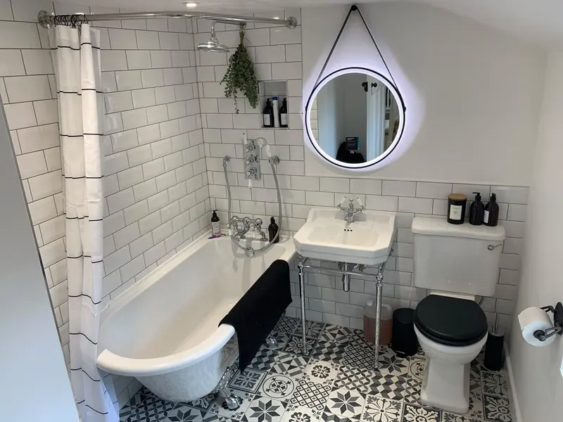Completed bathroom installation by C Hobbs Plumbing and Heating in Milton Keynes: tiling, sanitaryware and fitted brassware