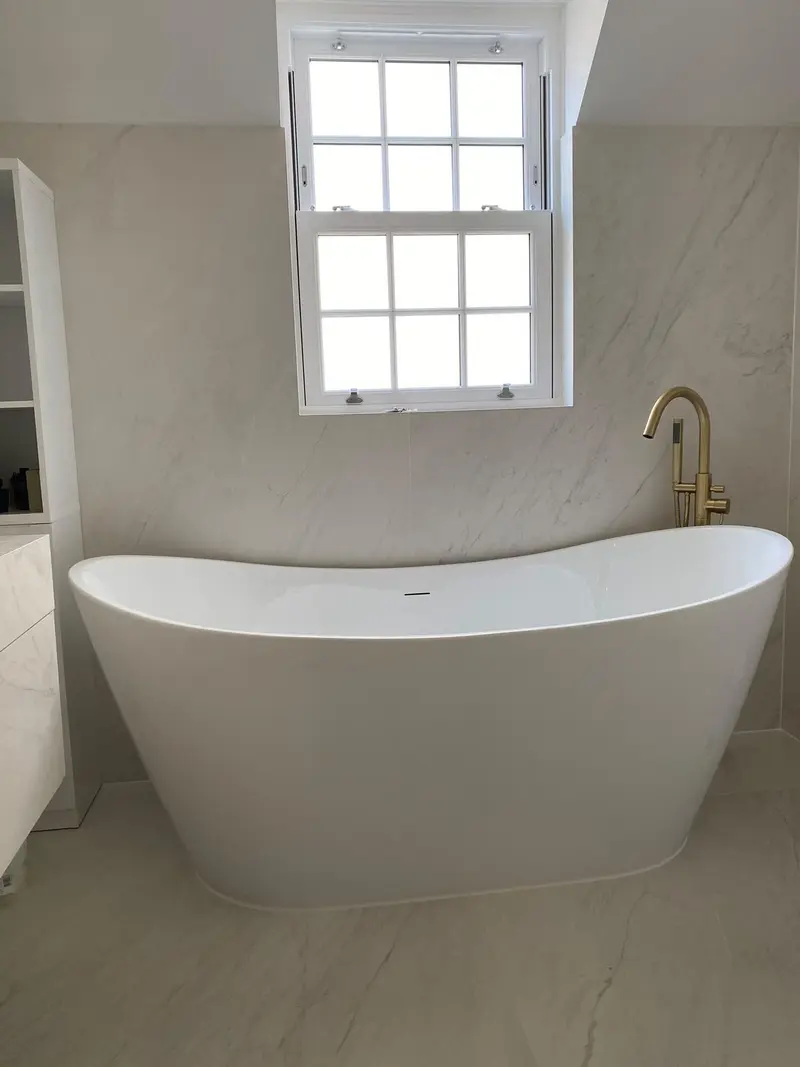 Completed bathroom installation by C Hobbs Plumbing and Heating in St Albans: tiling, sanitaryware and fitted brassware