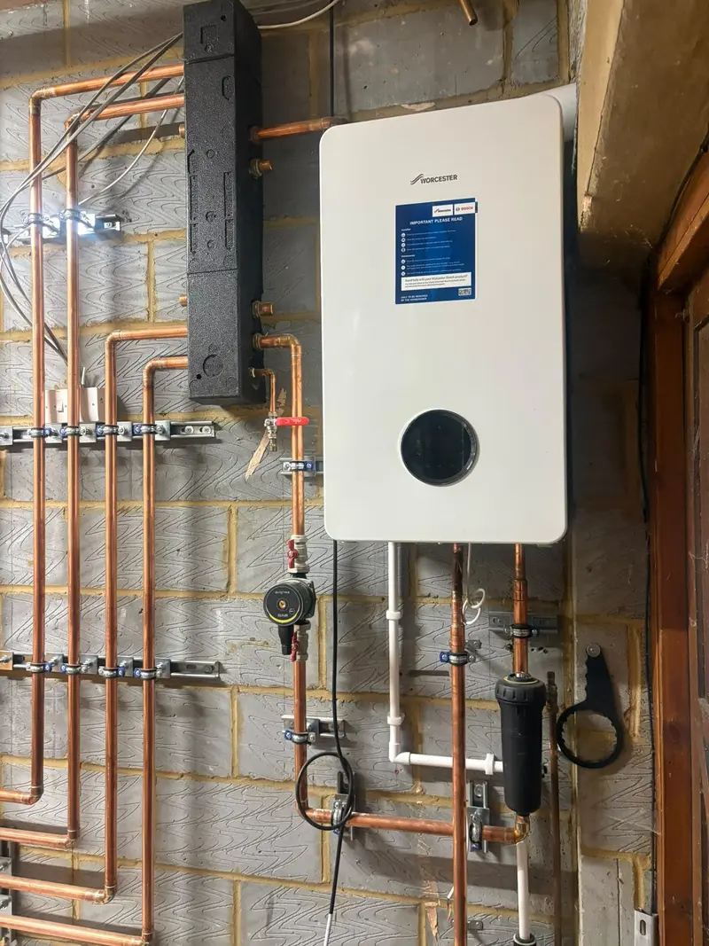 Wall-mounted Worcester gas boiler installation with new copper pipework by C Hobbs Plumbing and Heating in Milton Keynes