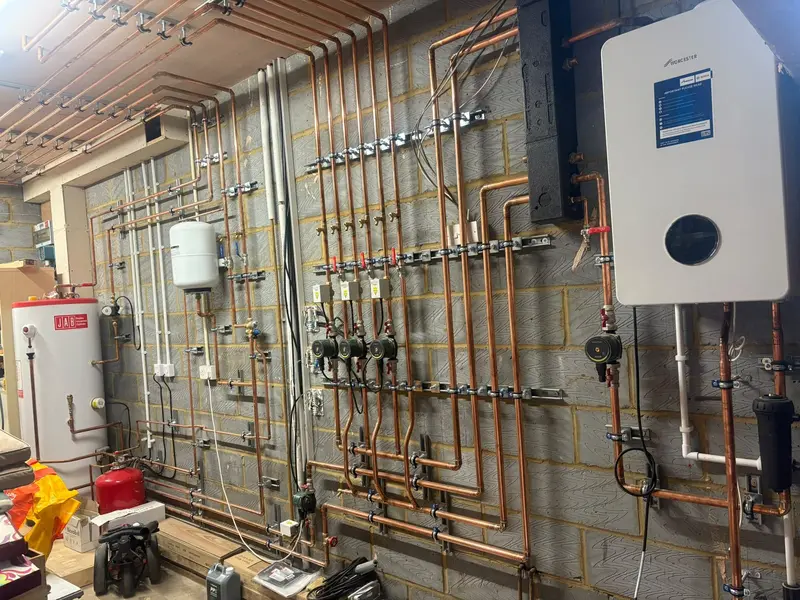 Gas Safe registered engineer servicing a gas boiler for C Hobbs Plumbing and Heating