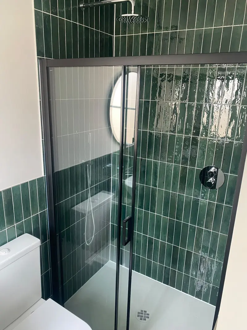 Completed bathroom installation by C Hobbs Plumbing and Heating in Milton Keynes: tiling, sanitaryware and fitted brassware