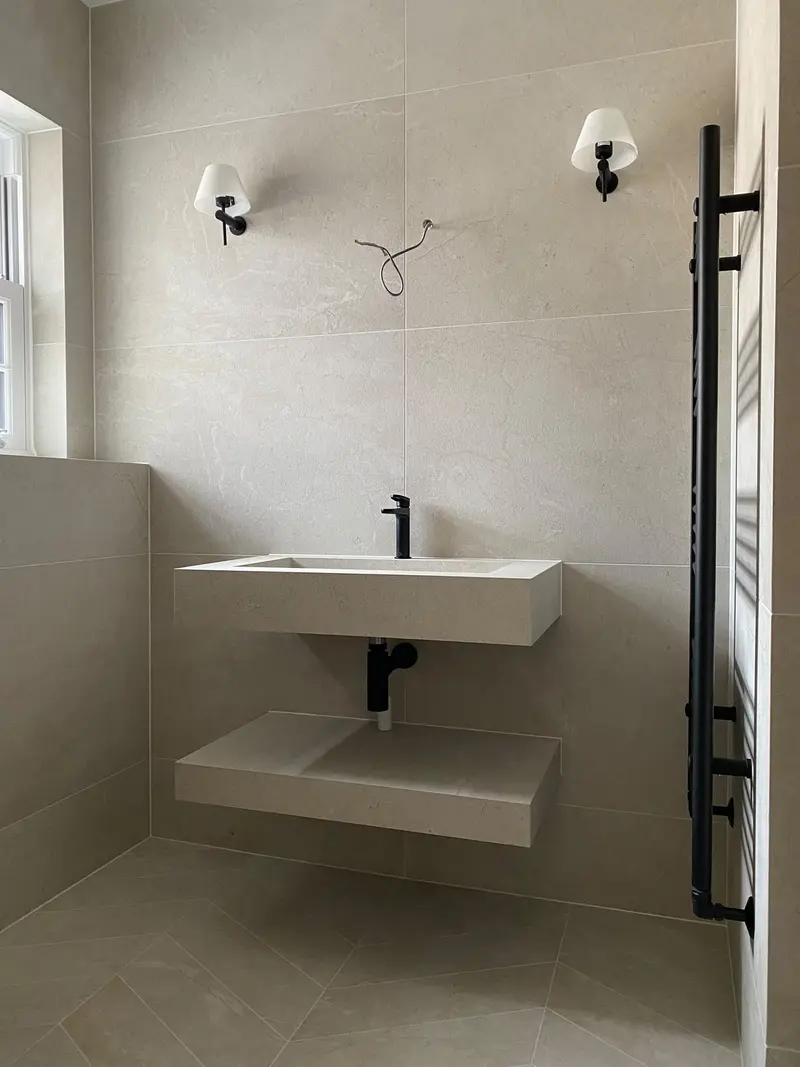 Completed bathroom installation by C Hobbs Plumbing and Heating in Hertfordshire: tiling, sanitaryware and fitted brassware