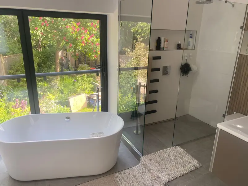 Completed bathroom installation by C Hobbs Plumbing and Heating in Hertfordshire: tiling, sanitaryware and fitted brassware