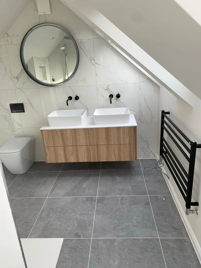 Completed bathroom installation by C Hobbs Plumbing and Heating in Dunstable: tiling, sanitaryware and fitted brassware