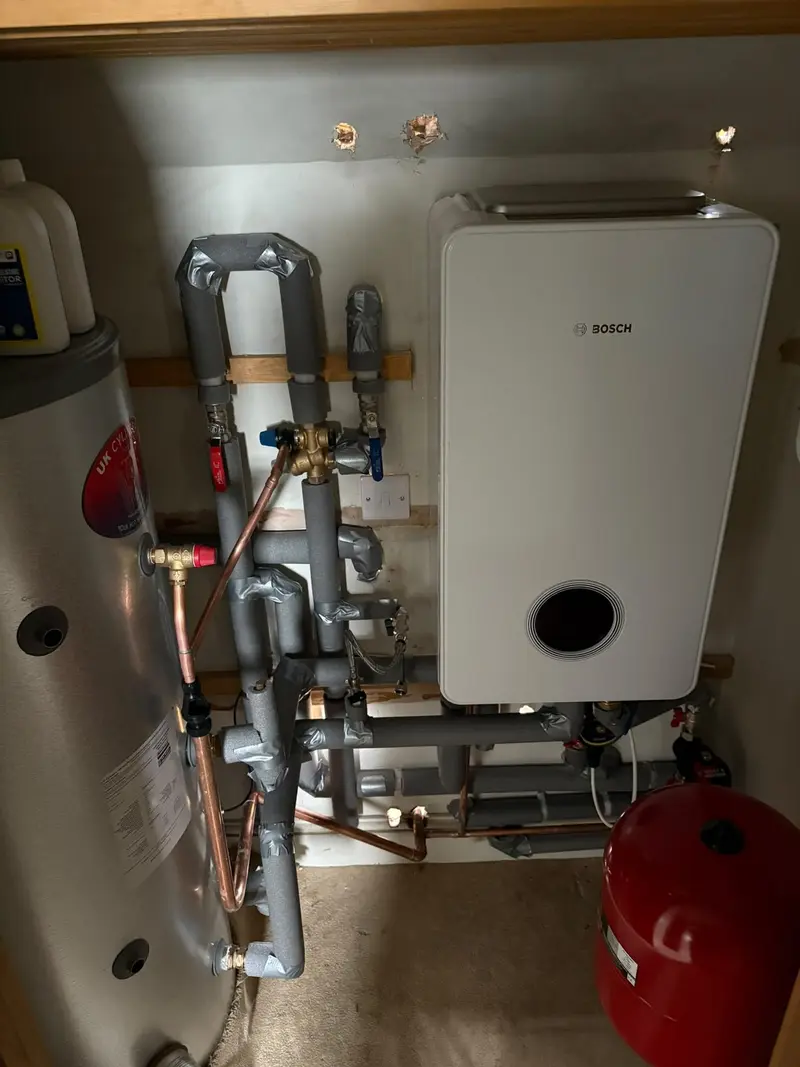 Bosch gas boiler installation with cylinder and expansion vessel by Gas Safe registered engineers at C Hobbs Plumbing and Heating in Bedfordshire