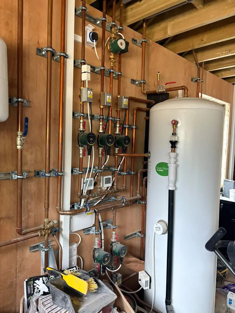 Central heating plant with pumps, valves and hot water cylinder installed by C Hobbs Plumbing and Heating in Dunstable