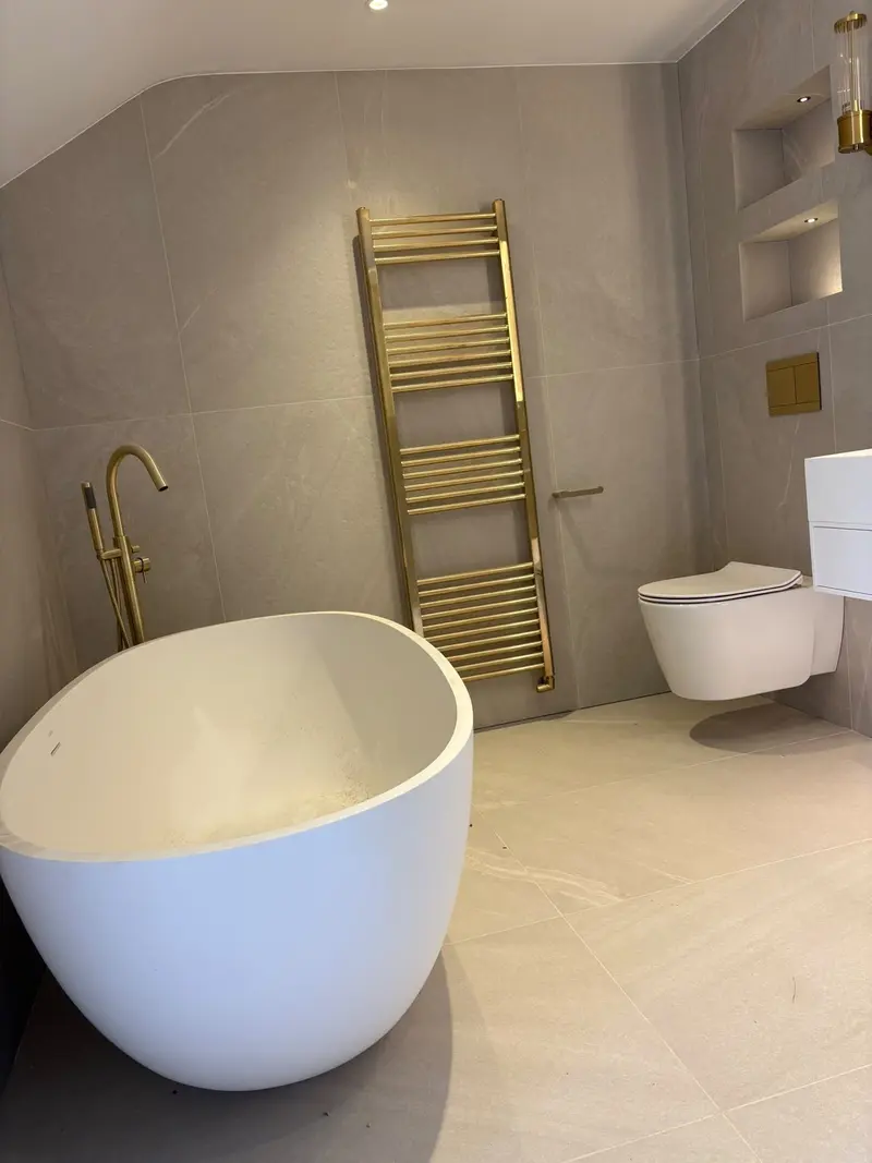 Completed bathroom installation by C Hobbs Plumbing and Heating in Milton Keynes: tiling, sanitaryware and fitted brassware