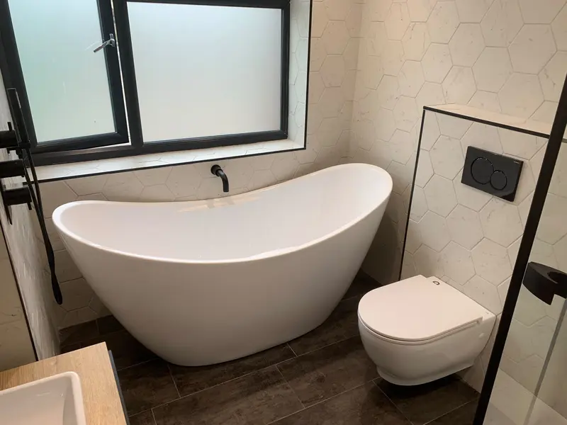 Completed bathroom installation by C Hobbs Plumbing and Heating in Dunstable: tiling, sanitaryware and fitted brassware