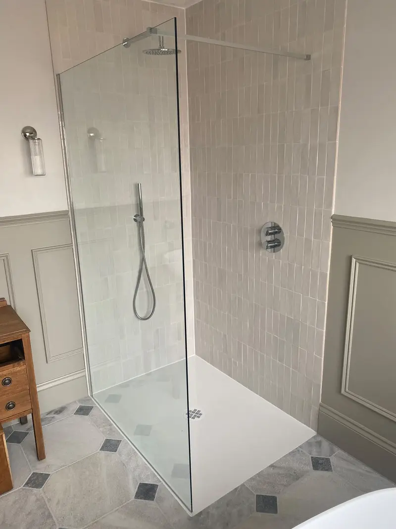 Completed bathroom installation by C Hobbs Plumbing and Heating in Harpenden: tiling, sanitaryware and fitted brassware
