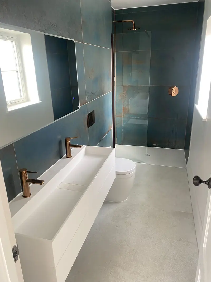 Completed bathroom installation by C Hobbs Plumbing and Heating in St Albans: tiling, sanitaryware and fitted brassware