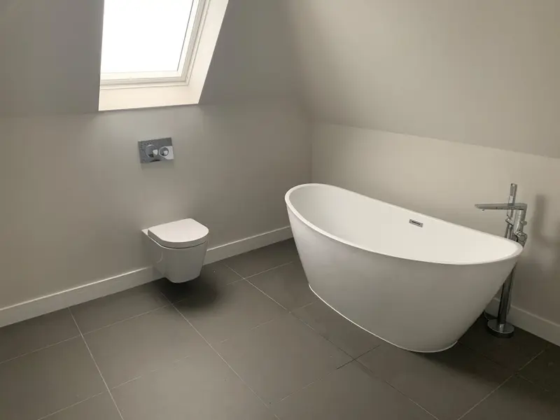 Completed bathroom installation by C Hobbs Plumbing and Heating in St Albans: tiling, sanitaryware and fitted brassware
