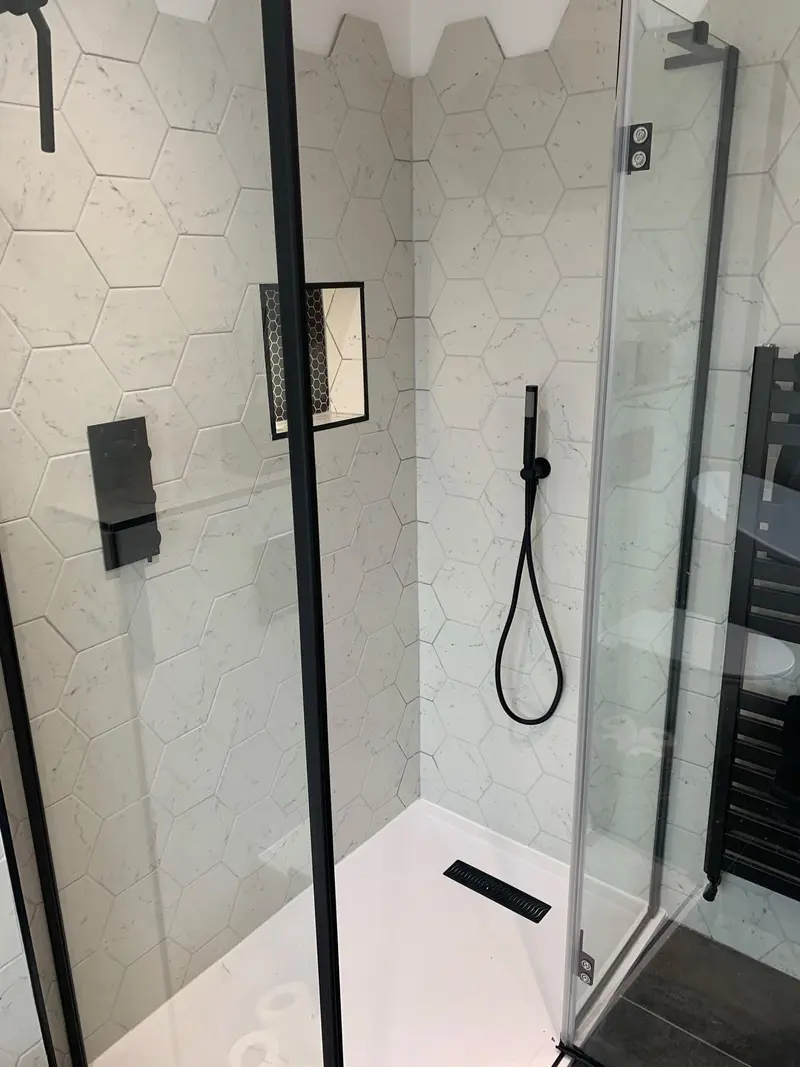 Completed bathroom installation by C Hobbs Plumbing and Heating in Hertfordshire: tiling, sanitaryware and fitted brassware