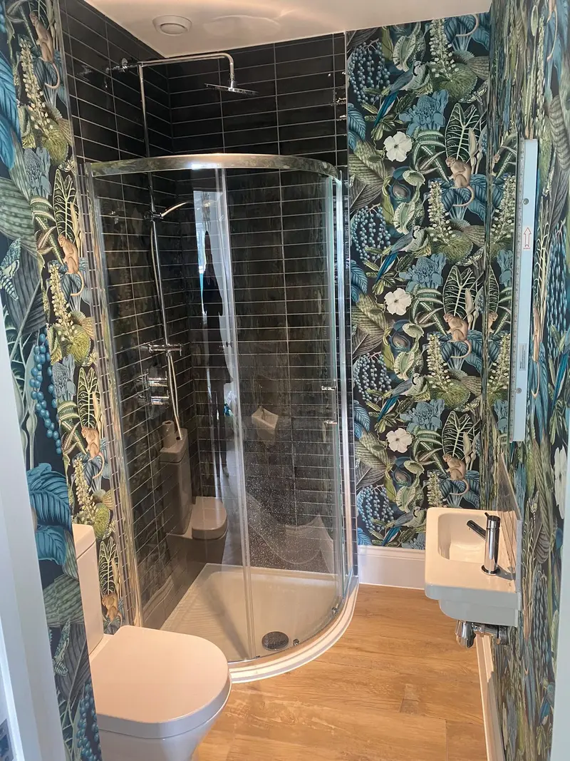 Completed bathroom installation by C Hobbs Plumbing and Heating in Luton: tiling, sanitaryware and fitted brassware