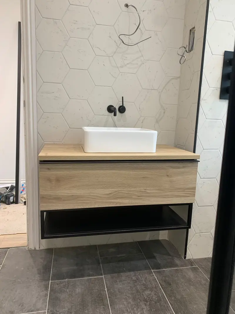 Completed bathroom installation by C Hobbs Plumbing and Heating in Dunstable: tiling, sanitaryware and fitted brassware