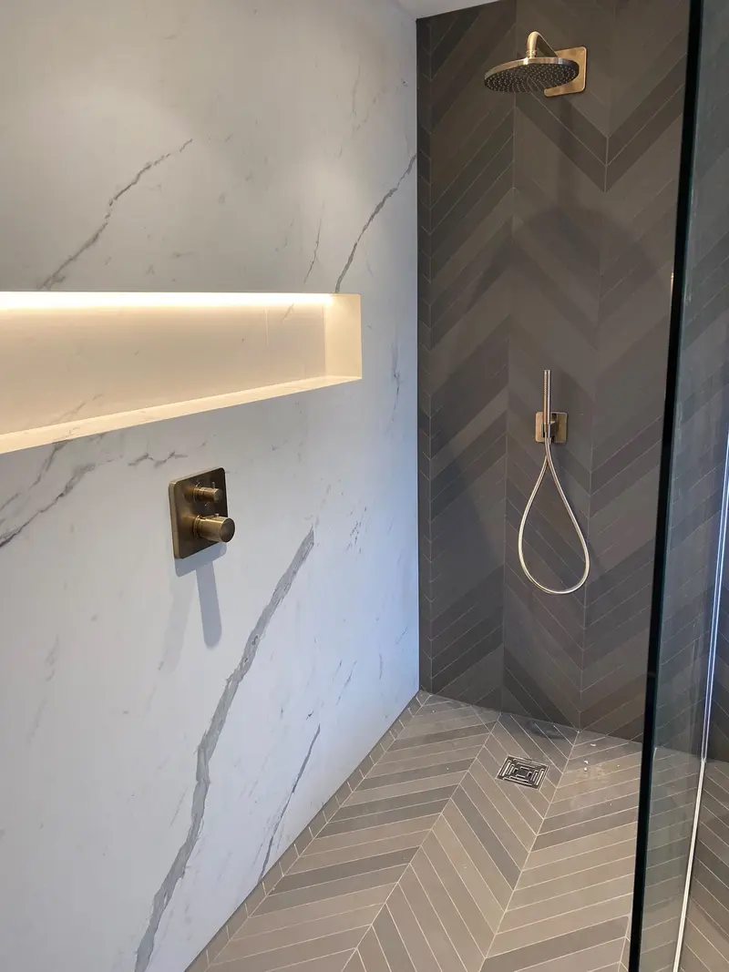 Completed bathroom installation by C Hobbs Plumbing and Heating in Bedfordshire: tiling, sanitaryware and fitted brassware