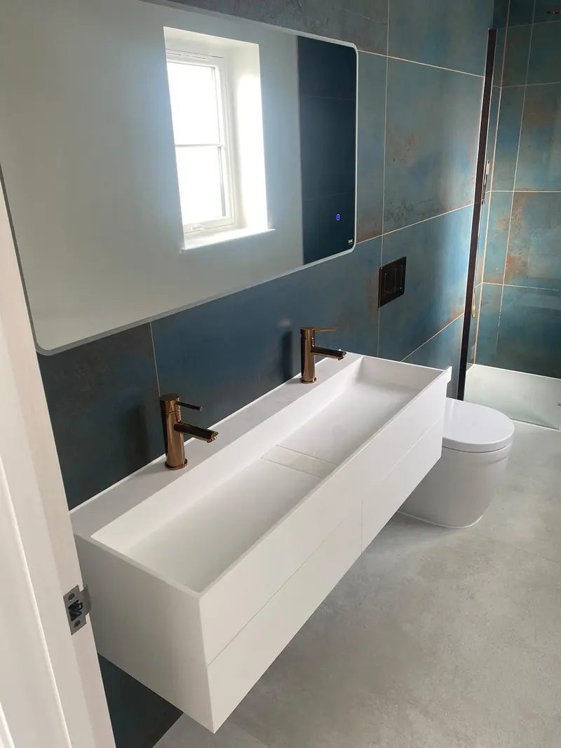 Completed bathroom installation by C Hobbs Plumbing and Heating in Bedfordshire: tiling, sanitaryware and fitted brassware