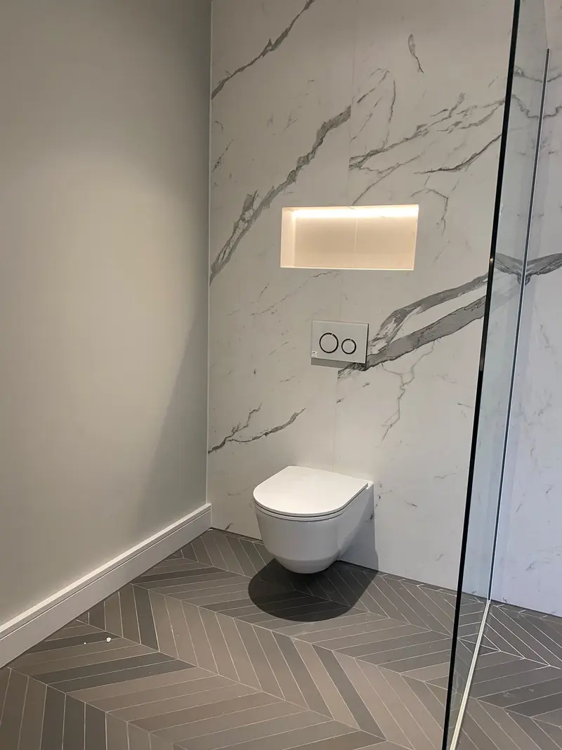 Completed bathroom installation by C Hobbs Plumbing and Heating in St Albans: tiling, sanitaryware and fitted brassware