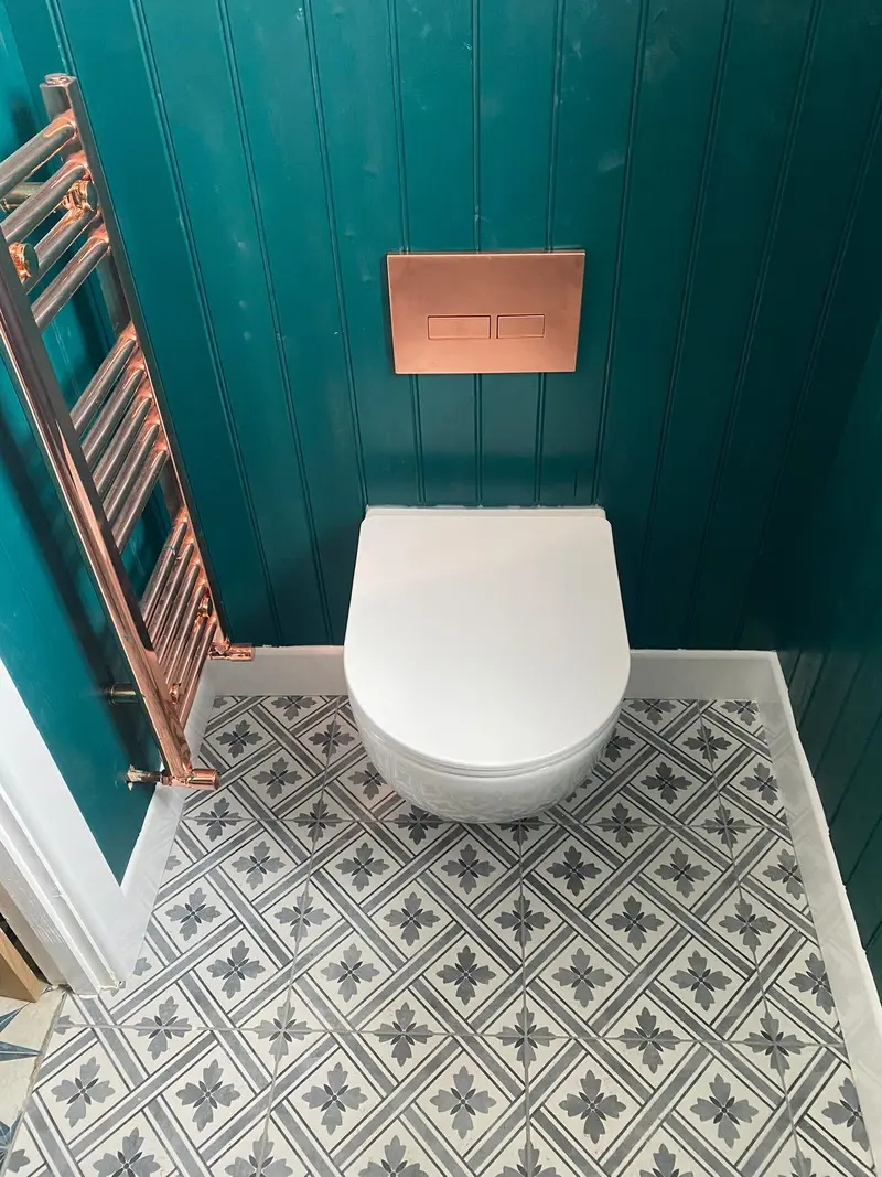 Completed bathroom installation by C Hobbs Plumbing and Heating in Milton Keynes: tiling, sanitaryware and fitted brassware