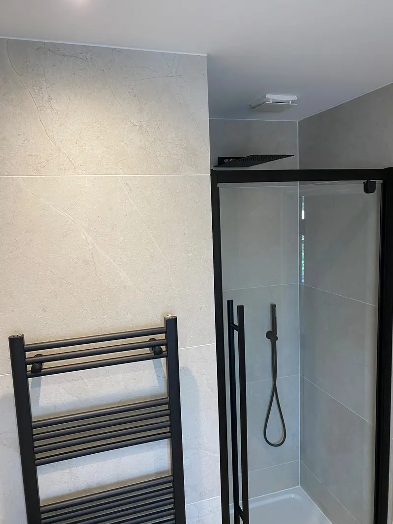 Completed bathroom installation by C Hobbs Plumbing and Heating in Milton Keynes: tiling, sanitaryware and fitted brassware