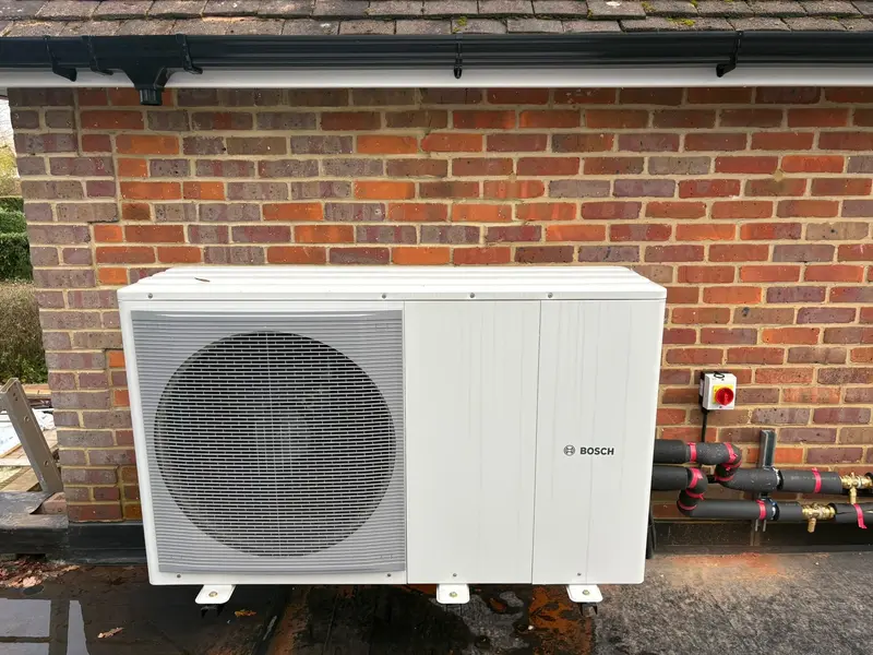 Air source heat pump installation outside a home by C Hobbs Plumbing and Heating in Hertfordshire