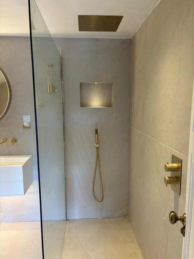 Completed bathroom installation by C Hobbs Plumbing and Heating in Harpenden: tiling, sanitaryware and fitted brassware